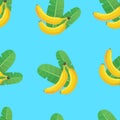 Bananas and banana leaves seamless pattern. Two bananas and two green leaves on a blue background. Vector pattern. Royalty Free Stock Photo